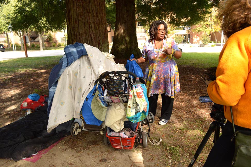 A woman named Butterfly packs her belongings in San Lorenzo Park in Santa Cruz. This photo was taken by Natalia Banaszczyk as part of a Santa Cruz project called “Not the Other: Oral Histories of People Experiencing Homelessness.”