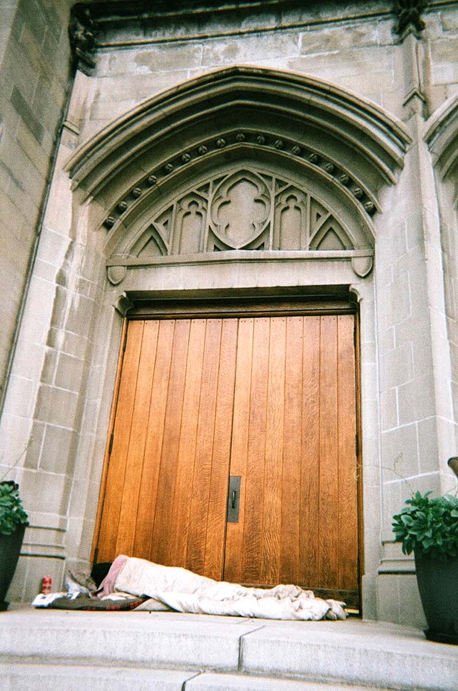Church.jpg “Heavenly Threshold.”  A homeless man finds refuge in a church doorway in Oakland. Pedro Del Norte photo