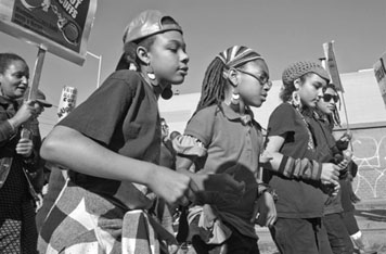 Children in a march celebrating the birthday of Rev. Martin Luther King Jr.