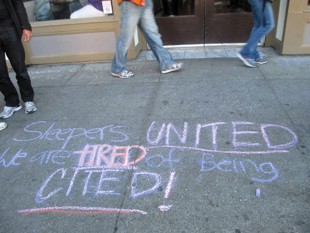 The finished message: “Sleepers United. We are tired of being cited!” Dozens of chalked messages have been written on Berkeley sidewalks. Sarah Menefee photo