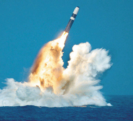 A missile is fired from a Trident submarine. Lockheed missile designer Robert Aldridge determined that their accuracy and explosive power give the Trident missiles a first-strike capability. 