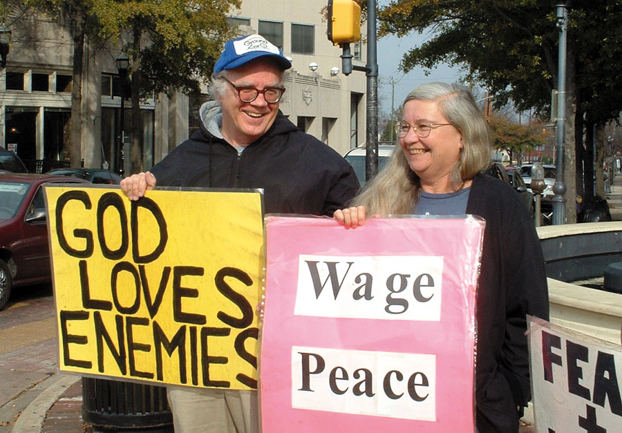 Jim and Shelley Douglass demonstrate against the Iraq War at their weekly peace vigil in Birmingham, Alabama.
