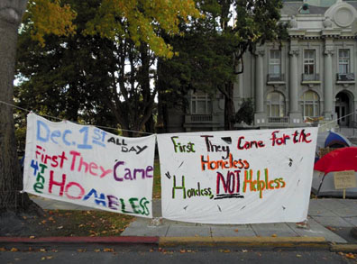 “First They Came for the Homeless.” An eye-catching banner hangs in front of the occupation on Martin Luther King Street in front of Berkeley City Hall. Lydia Gans photo