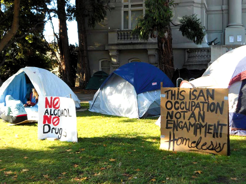 A sign in front of a tent at Berkeley’s old City Hall bears this message: “This is an occupation, not an encampment.” Lydia Gans photo