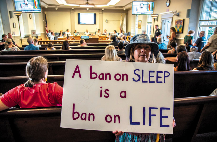 “A ban on sleep is a ban on life.” Freedom Sleepers take their message of protest inside the chambers of the Santa Cruz City Council. Alex Darocy photo
