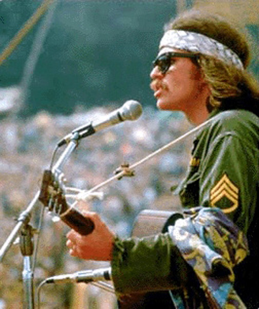 Country Joe McDonald sand "I Feel Like I'm Fixin' to Die rag" during his solo set before hundreds of thousands of people at Woodstock.