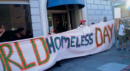 In honor of the first World Homeless Day, activists and homeless people rallied at San Francisco City Hall, and then staged a takeover of the vacant Leslie Hotel. Photo by Carol Harvey