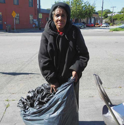 Darlene Bailey, a longtime Oakland recycler, is taking home bags for packaging the material she will put in the bins at the recycling center. Lydia Gans photo 