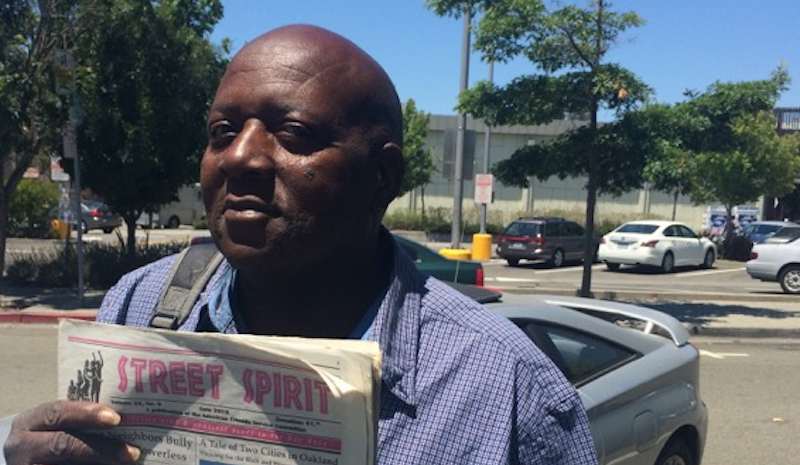 Alando Marcell Williams displays the June issue of Street Spirit. Photo and story by KALW