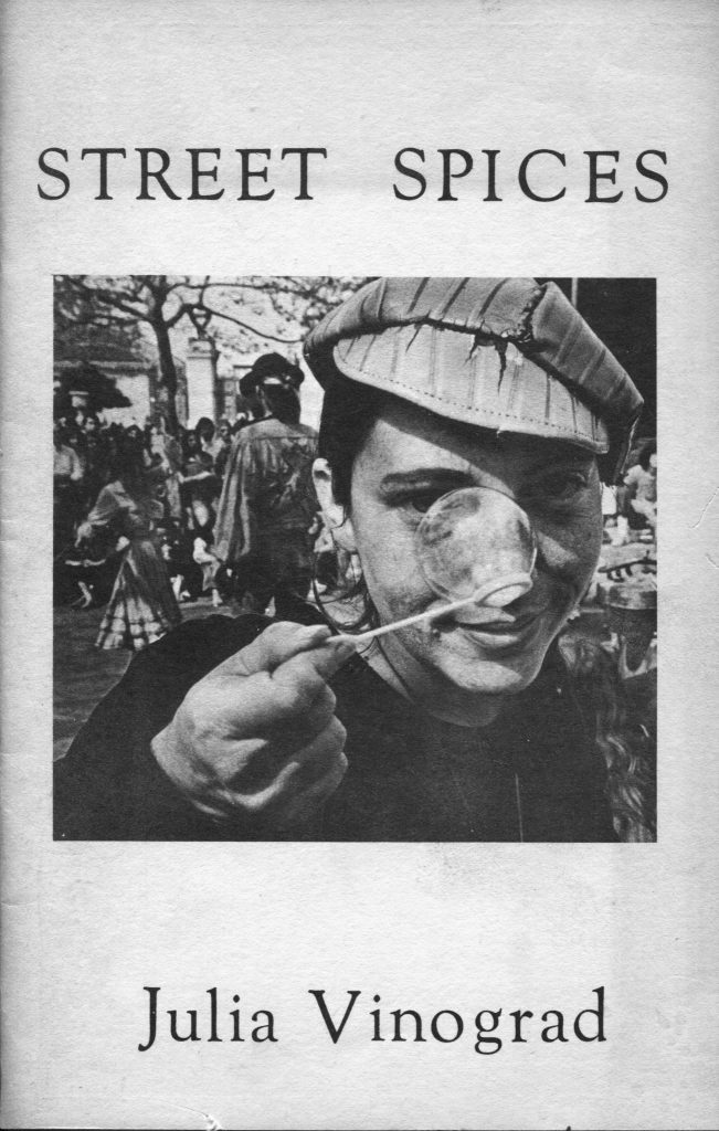 A portrait of a young Julia holding a bubble wand up to her nose on one of the first pages of "Street Spices," one of her poetry books. 