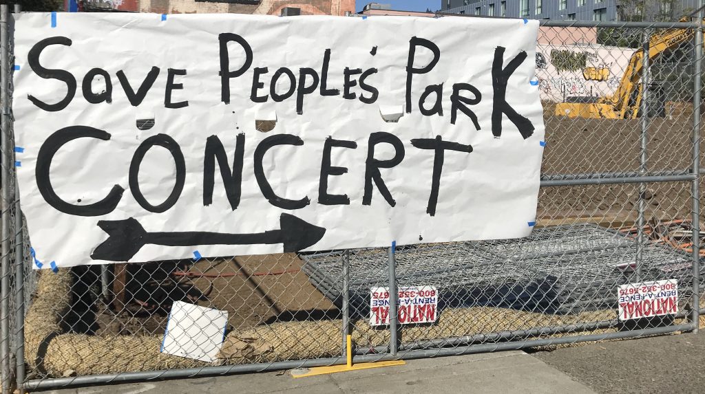 A sign advertising the concert reads "save people's park concert"