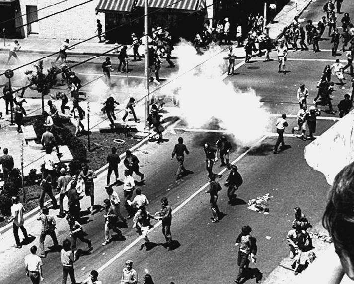 Protestors run from tear gas on Bloody Thursday.