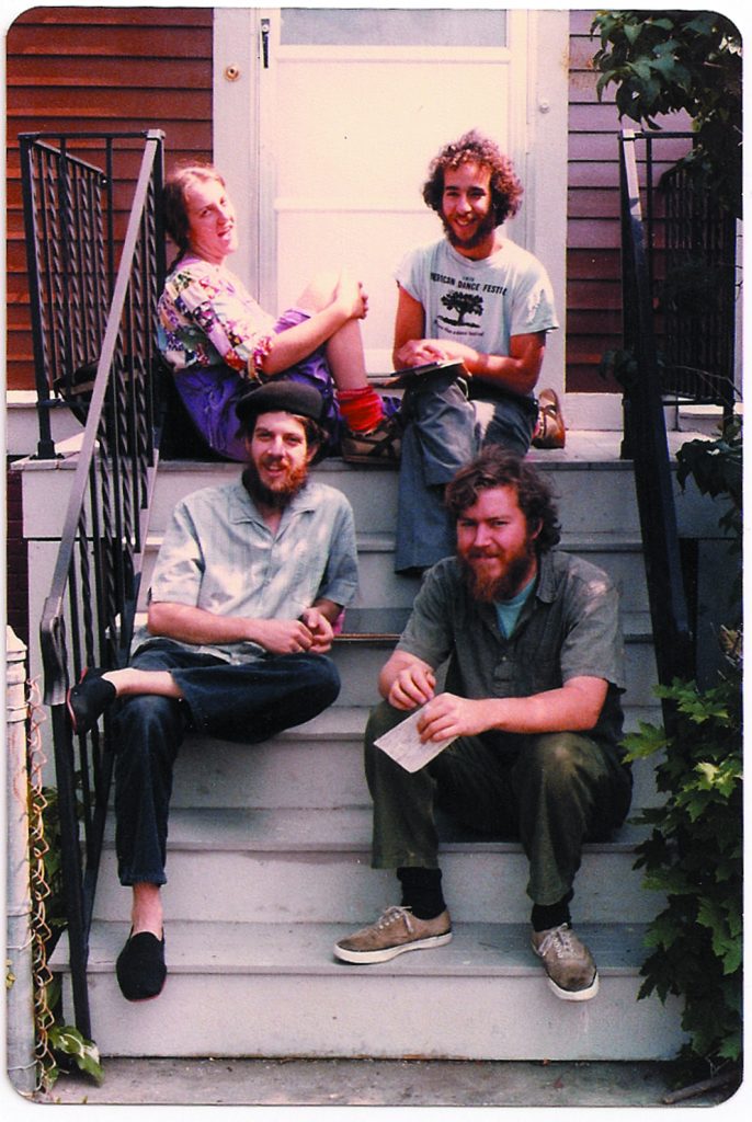 Food Not Bombs co-founders Susan Eaton, Brian Feigenbaum, CT, and Keith McHenry sitting outside their home in Cambridge, Massachusetts in 1981.