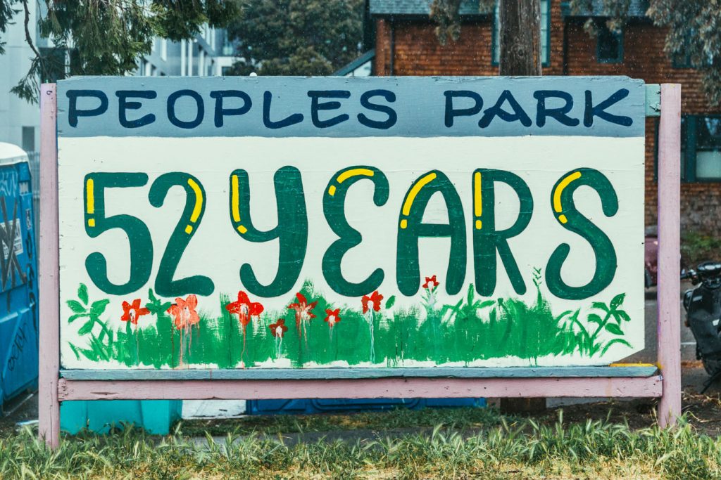 A hand painted sign that says "People's Park 52 years"