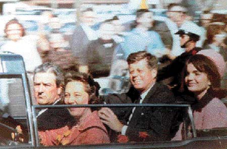 Amateur snapshot, made with Kodak Brownie, of the Kennedys and Connallys in the motorcade about two minutes before the shooting in Dealey Plaza.