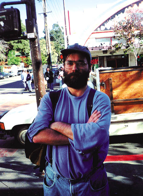 Paul “Blue” Nicoloff, dressed in blue, on Telegraph Avenue. Blue was a Berkeley street artist who had survived bouts of homelessness, but then committed suicide in the fall of 1999.