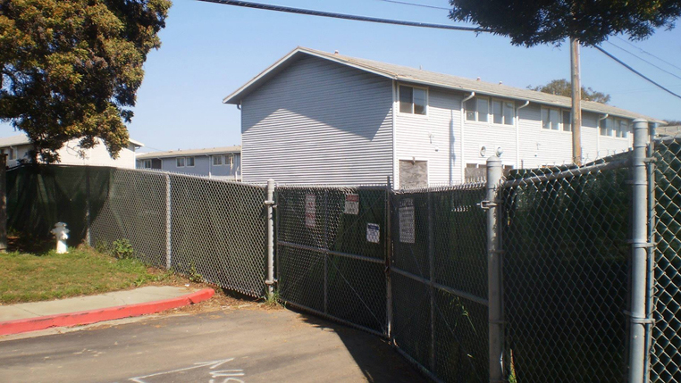 Houses at Treasure Island are fenced off while the work of toxic removal takes place.  Carol Harvey phogo