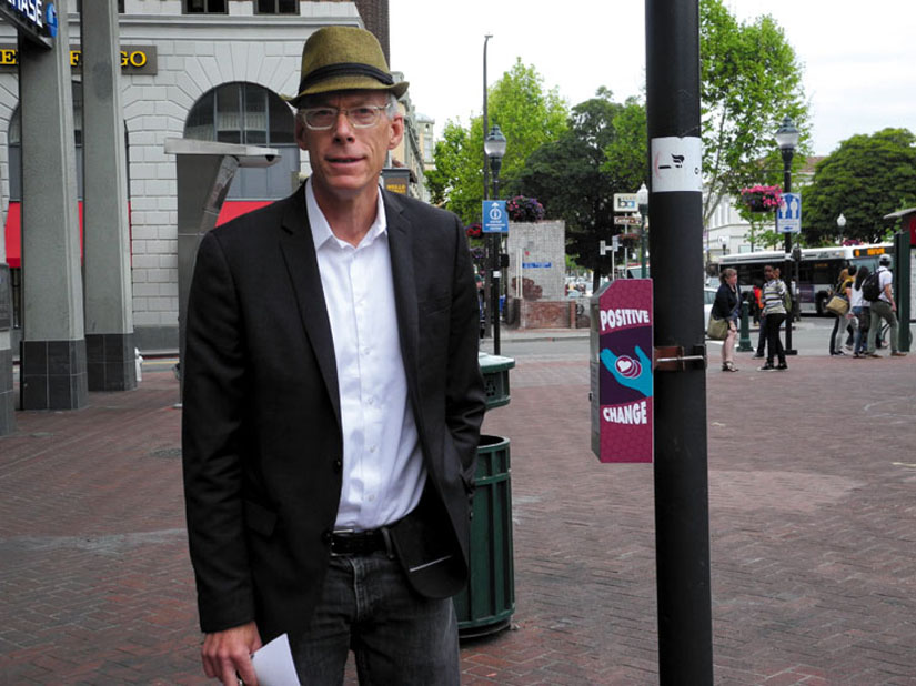 John Caner stands next to his Positive Change box on the pole. Caner has been instrumental in developing anti-homeless laws in Berkeley.  Carol Denney photo
