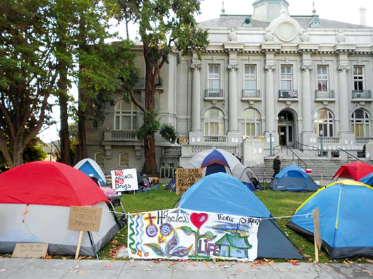 Homeless people have set up tents at City Hall and have created an occupation to make visible the injustices and hardships faced by homeless people. Lydia Gans photo