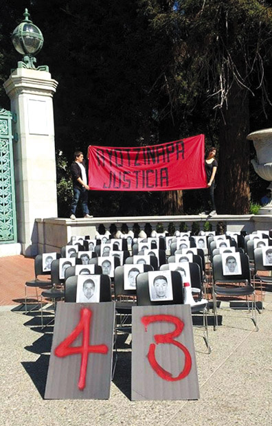 Students organized this demonstraton at the University of California at Berkeley where they placed the photos of the 43 disappeared student teachers of Ayotzinapa in empty school chairs.