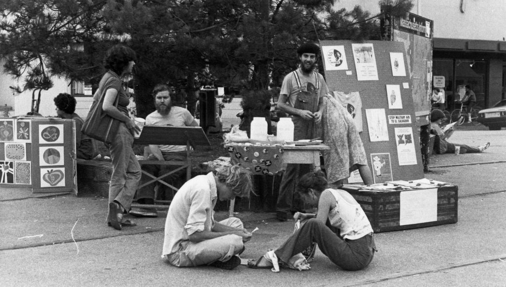 Food Not Bombs founders sit in Harvard Square in 1980.