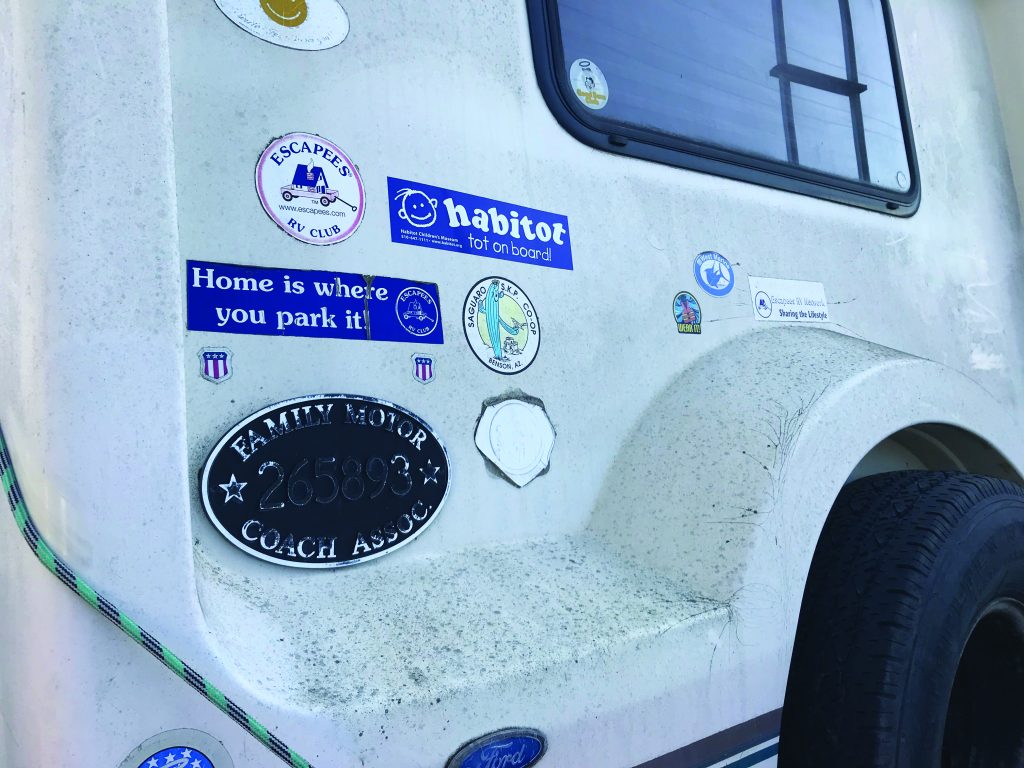 An RV in Berkeley with a bumper sticker that reads “home is where you park it.” 