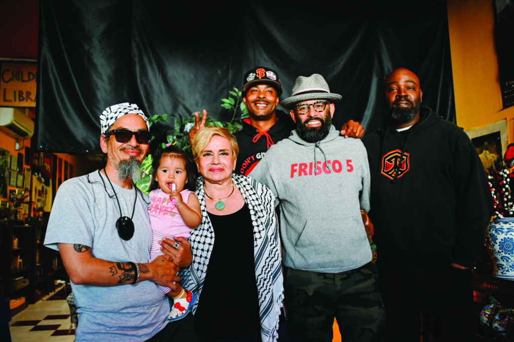 This is a picture of the Frisco 5 hunger strikers at the Black and Brown Social Club. They are standing together for a group photo.